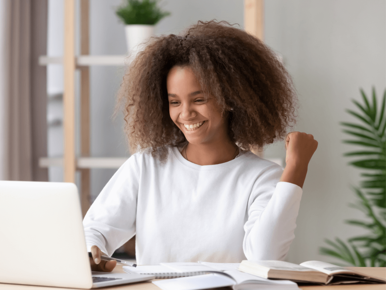 girl celebrating at the computer